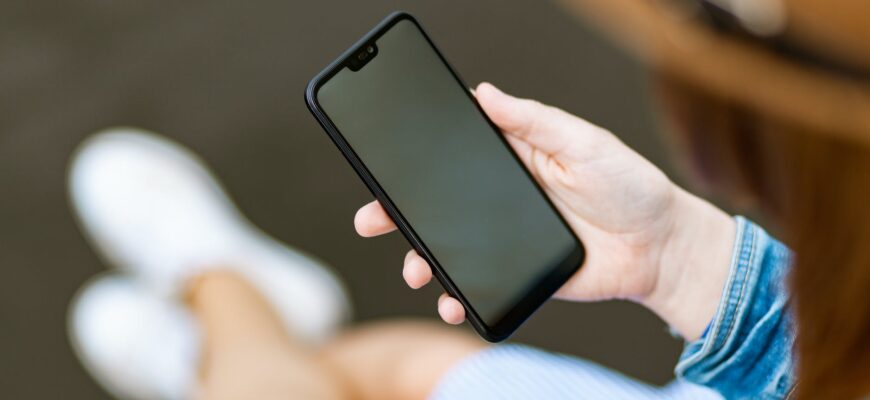 person holding black smartphone