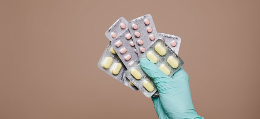 person holding medicines