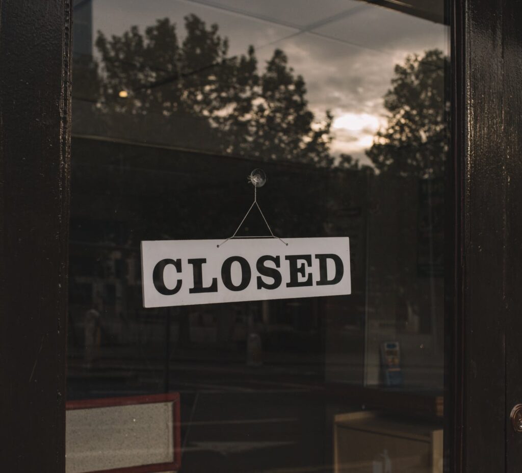closed sign on shop glass door