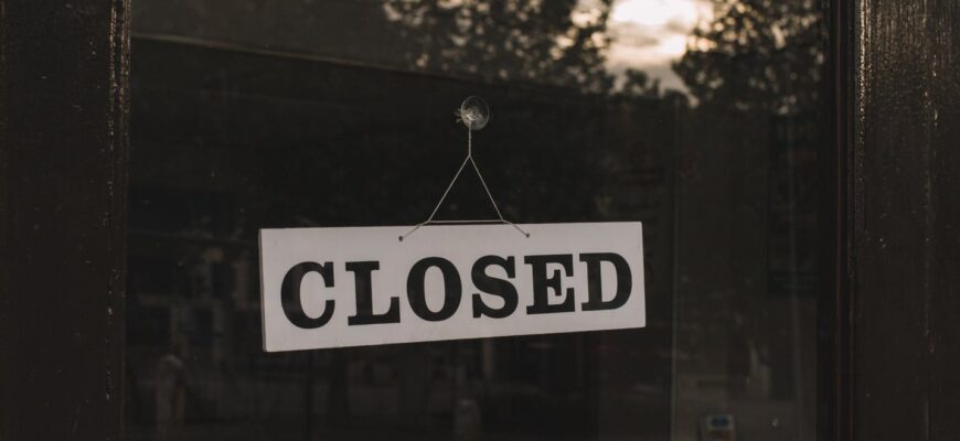 closed sign on shop glass door