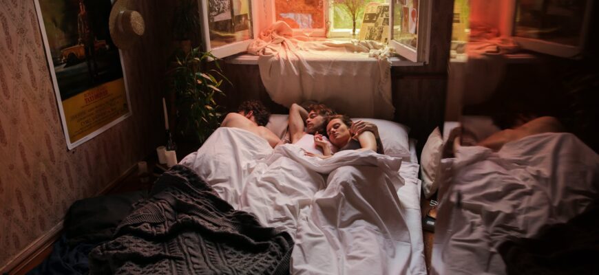 woman in white shirt lying on bed