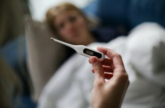 a person holding a thermometer