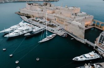 white and brown ship on sea