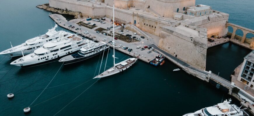 white and brown ship on sea