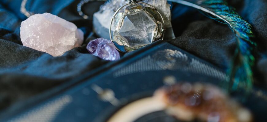 silver and gold ring on blue textile