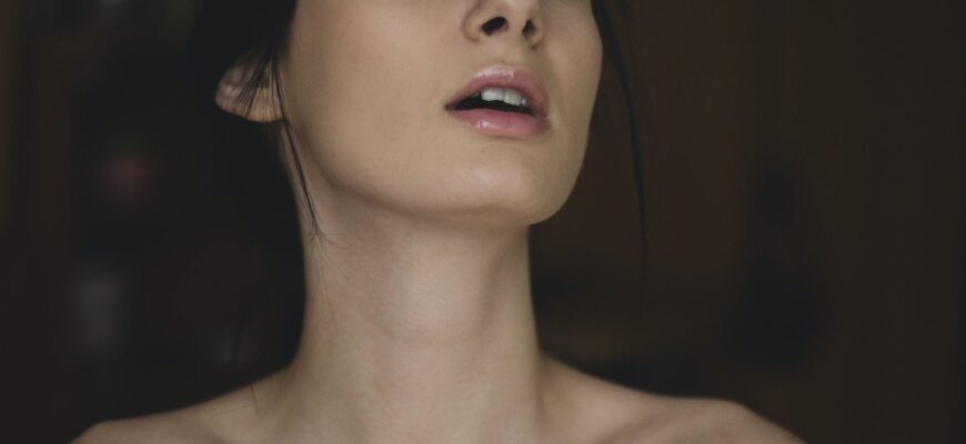 topless woman closing her eyes