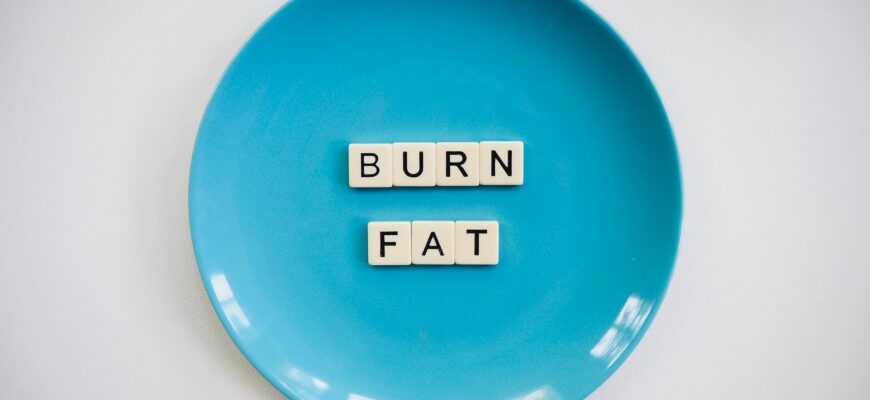 photo of a burn fat text on round blue plate