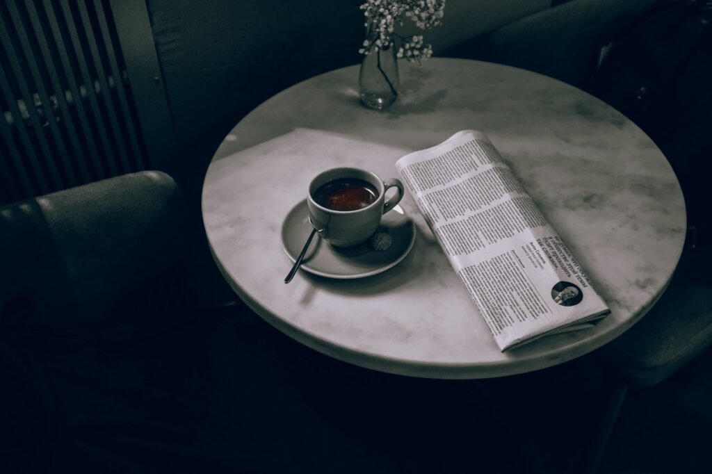 ceramic cup on ceramic saucer on round table