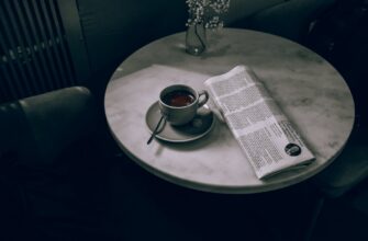 ceramic cup on ceramic saucer on round table