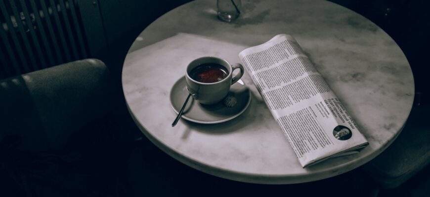 ceramic cup on ceramic saucer on round table