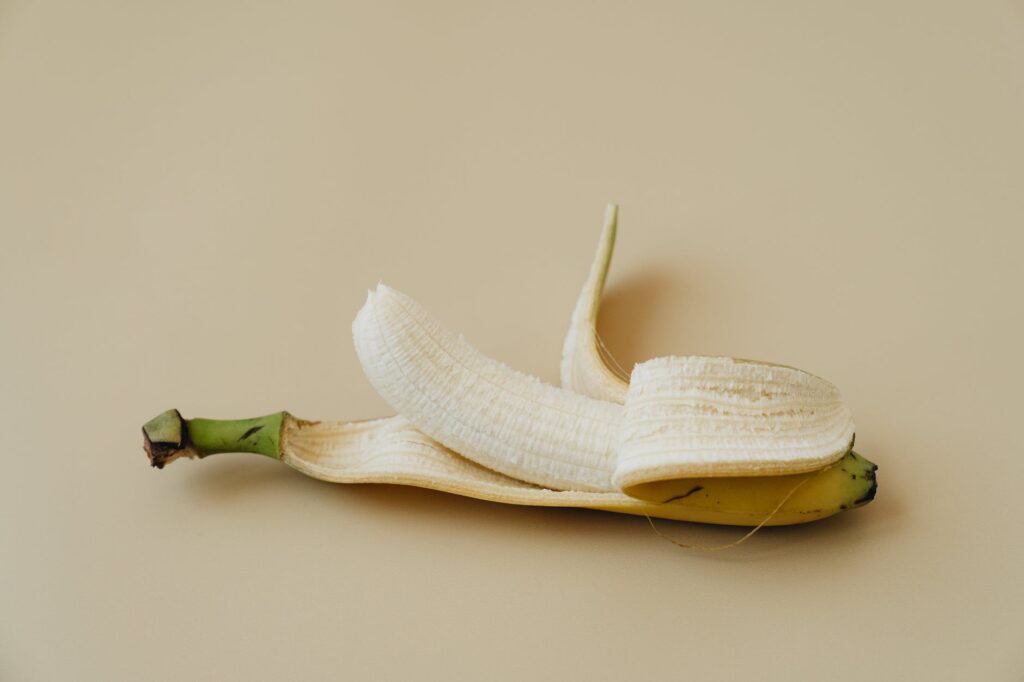 a close up shot of a peeled banana