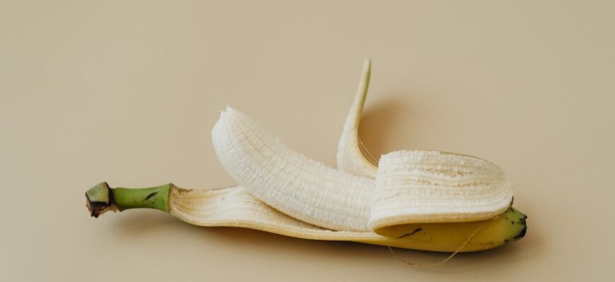 a close up shot of a peeled banana