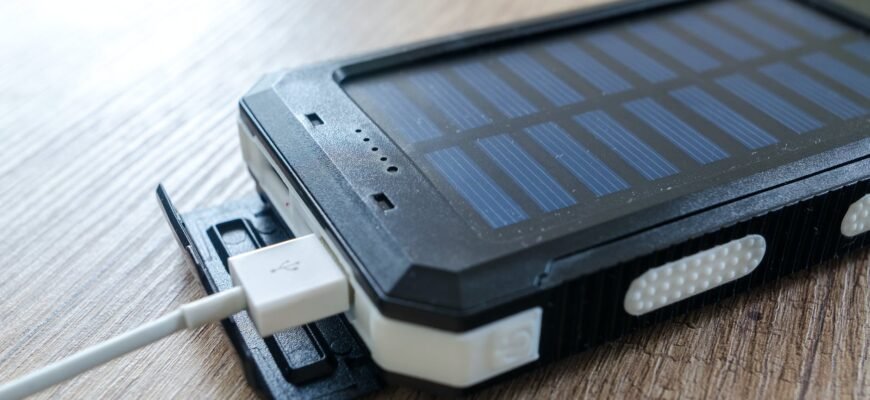 black solar power bank on brown surface
