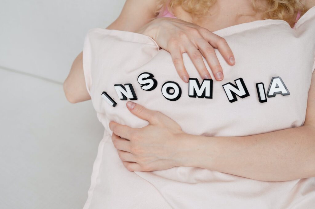 woman hugging a pillow