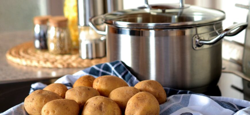 potatoes beside stainless steel cooking pot