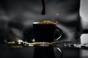 cup of coffee spilled on black table