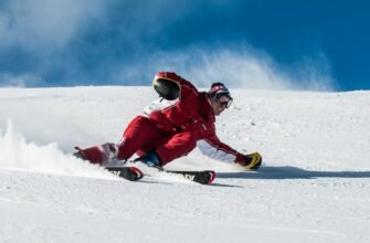 man on ski board on snow field