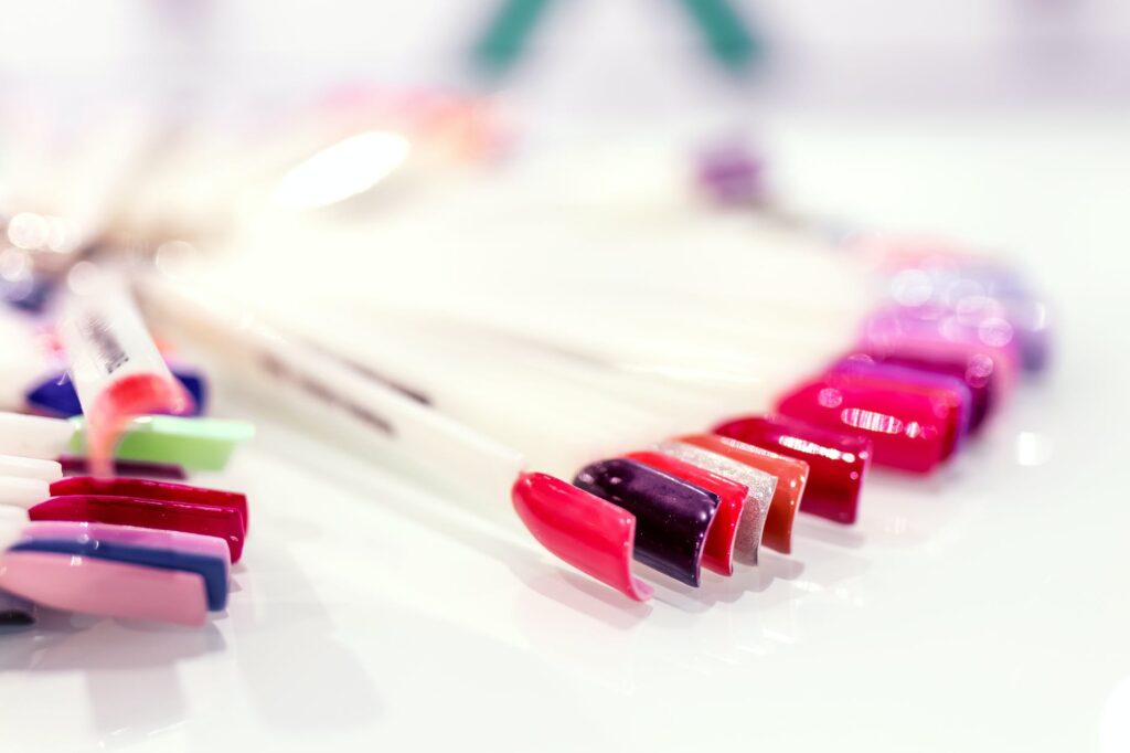 selective focus photography of assorted polished artificial nails