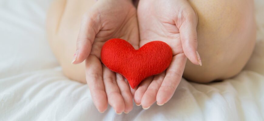 crop woman with heart on palms