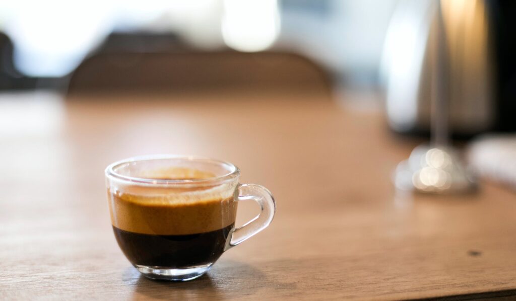 selective focus photography of a cup of black coffee