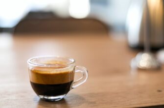 selective focus photography of a cup of black coffee