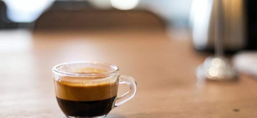 selective focus photography of a cup of black coffee