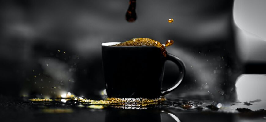 cup of coffee spilled on black table