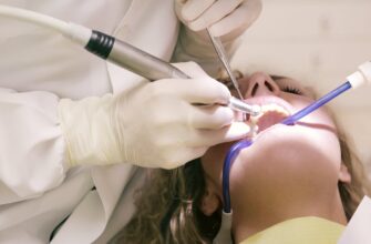 dentist working working on woman s teeth
