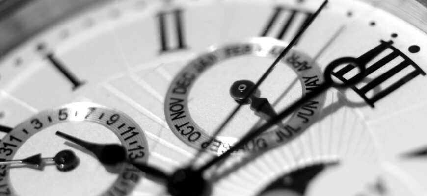 round silver colored chronograph watch