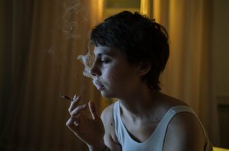 photo of a woman with short hair smoking a cigarette