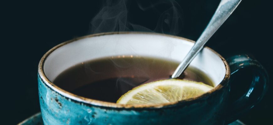 photography of blue ceramic coffee cup