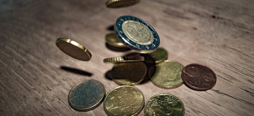 close up of coins on table