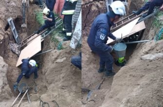 FOTO// Doi bărbați au fost scoși vii de salvatori după ce au rămas prinși sub un mal de pământ