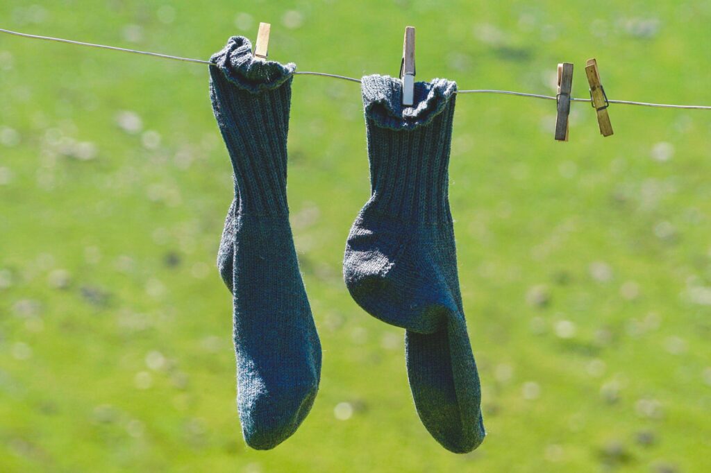 pair of blue socks hanging