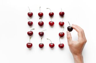 cherry on person s hand