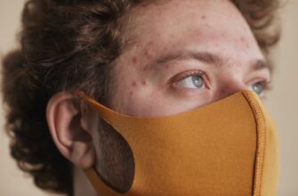 a man wearing a brown face mask