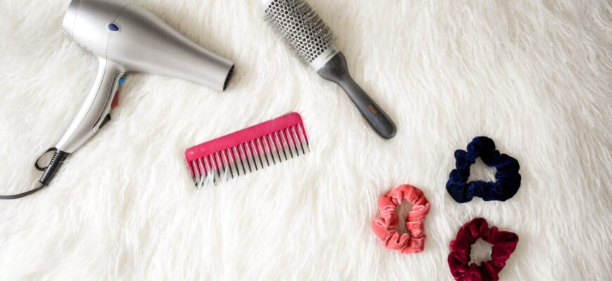 grey hair blower near pink hair combs and scrunchies