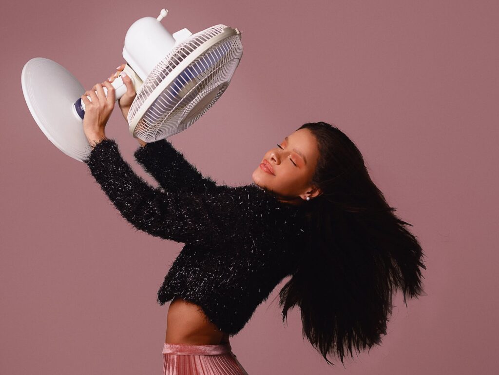 woman holding fan
