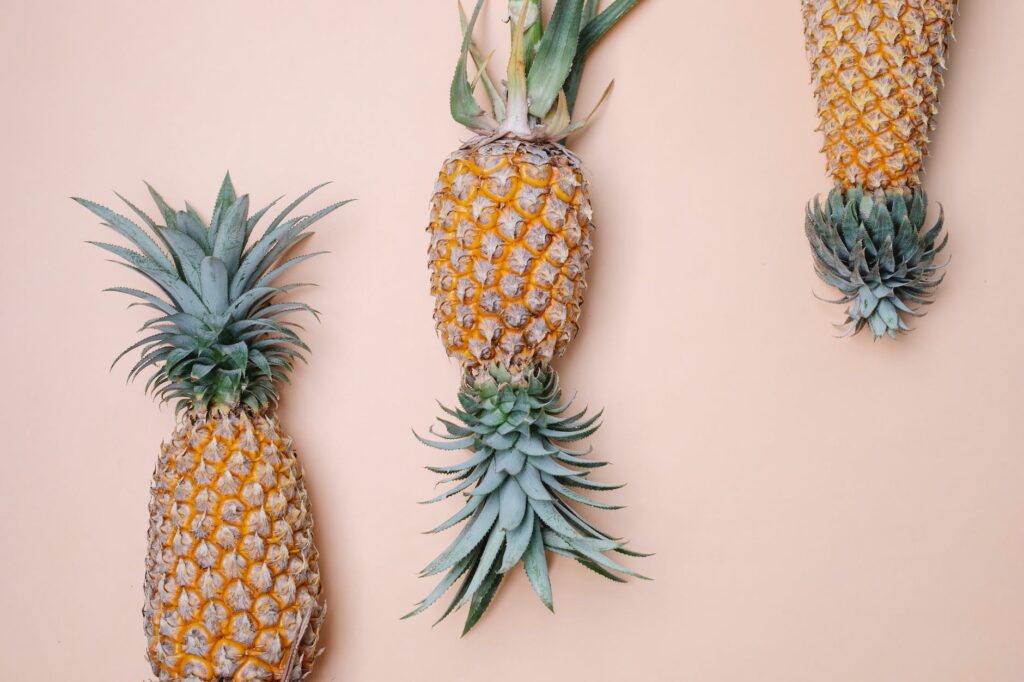 big pineapples on beige surface