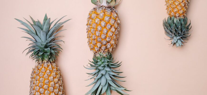 big pineapples on beige surface