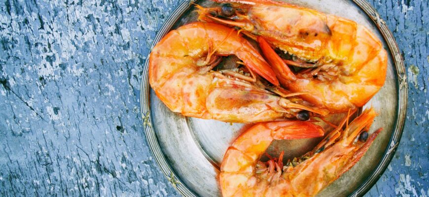 three cooked shrimps on can