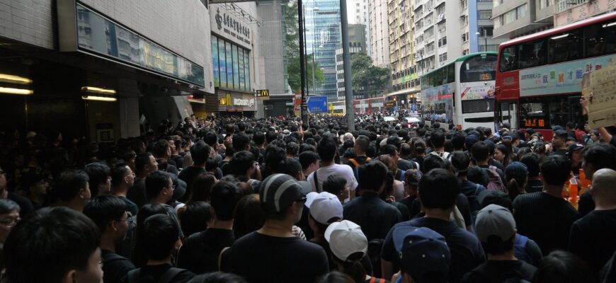 ethnic group of people moving in street