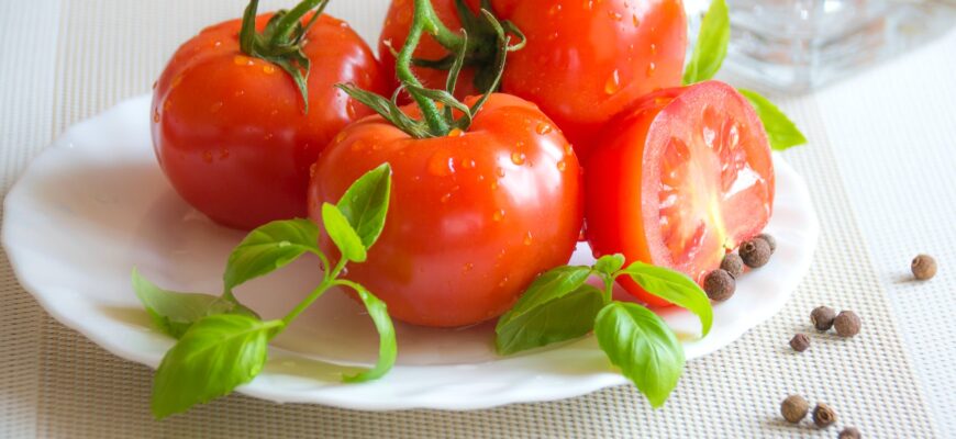 tomato top of white ceramic plate