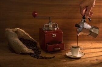 a close up shot of a person pouring coffee from a moka pot