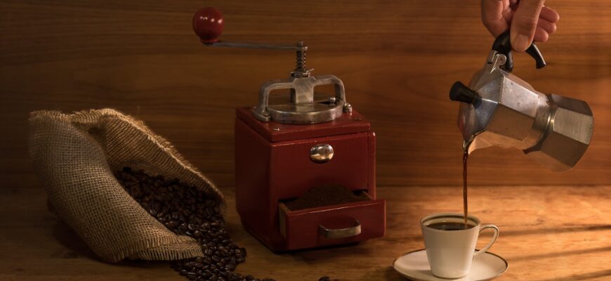 a close up shot of a person pouring coffee from a moka pot