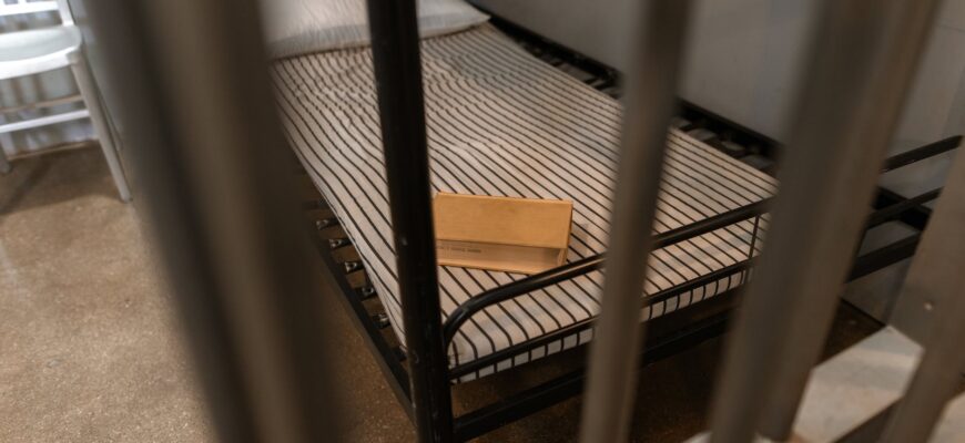 brown wooden box on a striped foam mattress