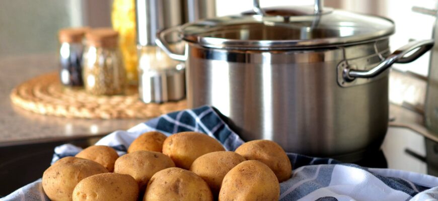 potatoes beside stainless steel cooking pot