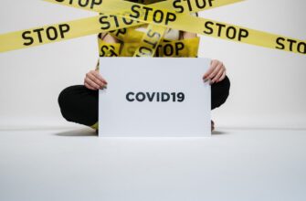 person holding covid sign