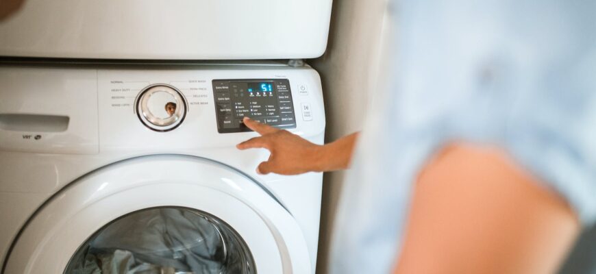 person using washing machine