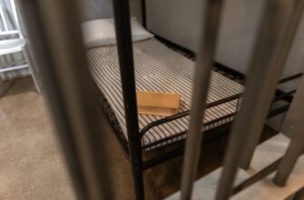 brown wooden box on a striped foam mattress